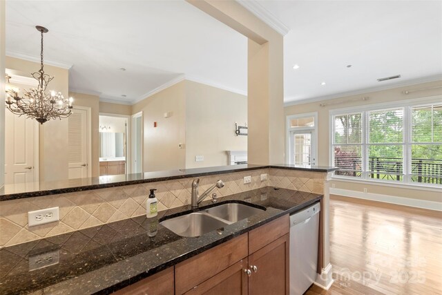 5425 Closeburn Rd Unit 208, Charlotte, NC 28210 - kitchen with dishwasher, a sink, brown cabinetry, decorative backsplash, and pendant lighting