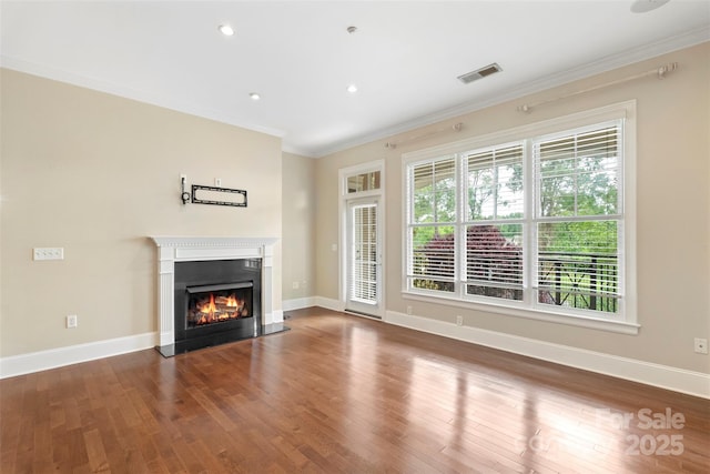 5425 Closeburn Rd Unit 208, Charlotte, NC 28210 - unfurnished living room with wood finished floors, ornamental molding, a warm lit fireplace, baseboards, and recessed lighting