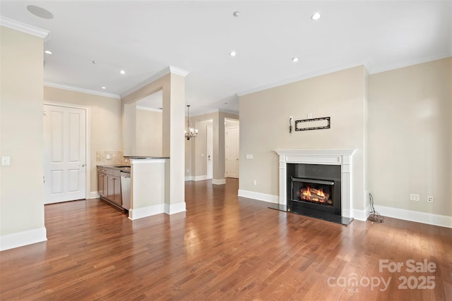 5425 Closeburn Rd Unit 208, Charlotte, NC 28210 - unfurnished living room featuring a lit fireplace, ornamental molding, recessed lighting, a chandelier, and dark wood-style floors
