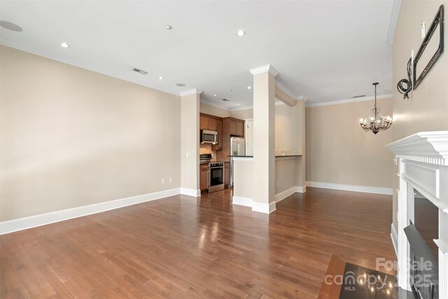 5425 Closeburn Rd Unit 208, Charlotte, NC 28210 - unfurnished living room with a chandelier, baseboards, dark wood finished floors, recessed lighting, and a fireplace
