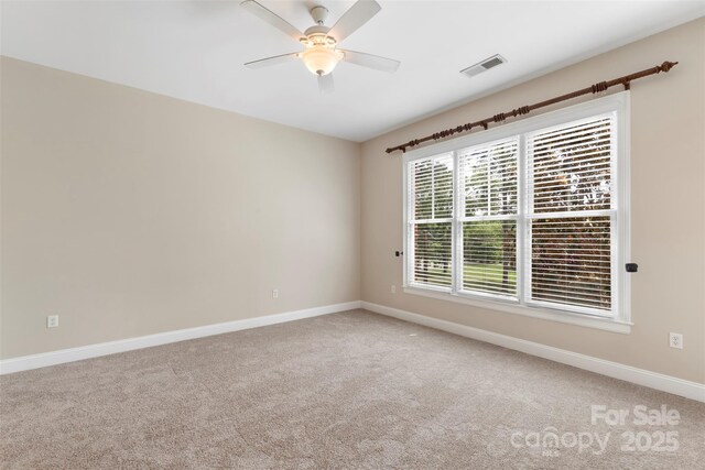 5425 Closeburn Rd Unit 208, Charlotte, NC 28210 - spare room featuring light carpet, baseboards, and ceiling fan