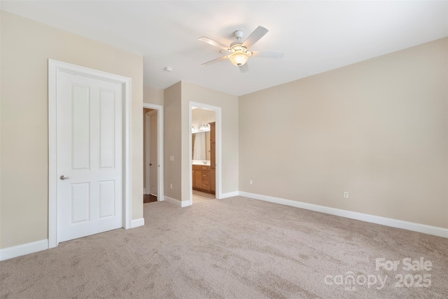 5425 Closeburn Rd Unit 208, Charlotte, NC 28210 - unfurnished bedroom featuring light colored carpet, baseboards, ensuite bath, and ceiling fan