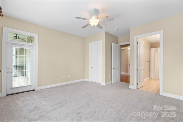 5425 Closeburn Rd Unit 208, Charlotte, NC 28210 - unfurnished bedroom with carpet flooring, baseboards, access to outside, and a ceiling fan