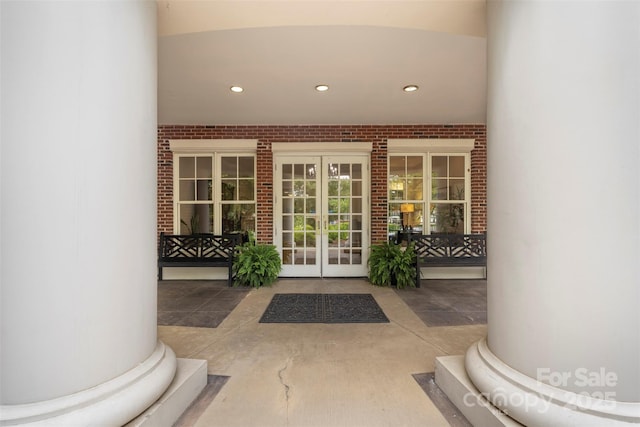5425 Closeburn Rd Unit 208, Charlotte, NC 28210 - view of exterior entry featuring french doors, brick siding, and stucco siding