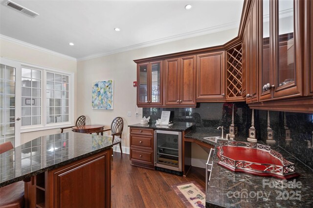 5425 Closeburn Rd Unit 208, Charlotte, NC 28210 - kitchen with beverage cooler, dark wood-type flooring, glass insert cabinets, decorative backsplash, and recessed lighting