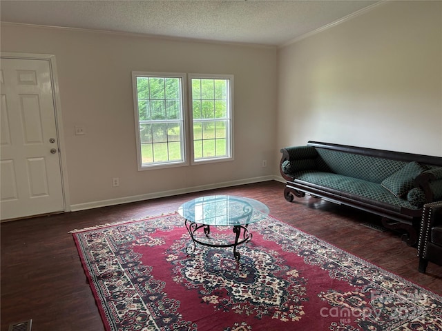 1896 Green Creek Dr E, Tryon, NC 28782 - living room featuring crown molding, wood finished floors, baseboards, and a textured ceiling