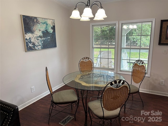 1896 Green Creek Dr E, Tryon, NC 28782 - dining space featuring crown molding, a chandelier, baseboards, and wood finished floors