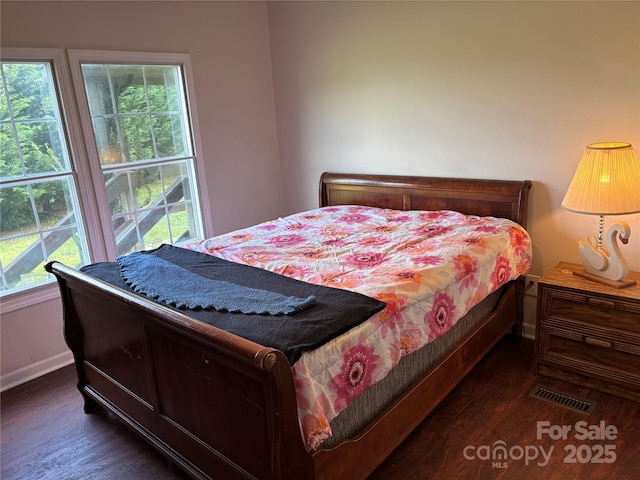1896 Green Creek Dr E, Tryon, NC 28782 - bedroom with baseboards and dark wood-style flooring