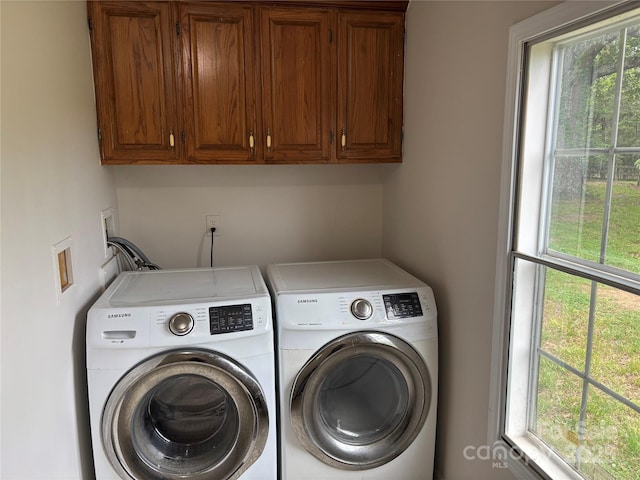 1896 Green Creek Dr E, Tryon, NC 28782 - laundry area with cabinet space, separate washer and dryer, and healthy amount of natural light