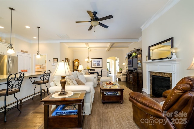 8818 Artesa Mill Ln, Charlotte, NC 28214 - living area with a ceiling fan, arched walkways, a high end fireplace, coffered ceiling, and dark wood-style floors