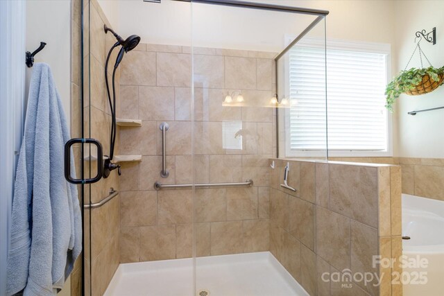 8818 Artesa Mill Ln, Charlotte, NC 28214 - bathroom with a shower stall and a bath