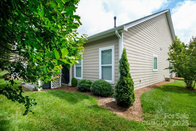 8818 Artesa Mill Ln, Charlotte, NC 28214 - view of property exterior with a yard