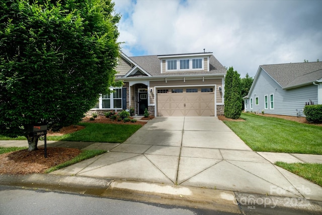 8818 Artesa Mill Ln, Charlotte, NC 28214 - craftsman-style house with driveway, a front lawn, stone siding, a garage, and a shingled roof