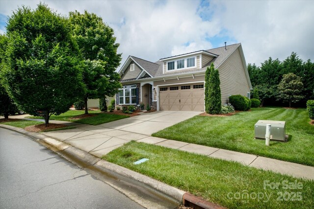 8818 Artesa Mill Ln, Charlotte, NC 28214 - view of front facade featuring driveway, a front lawn, and a garage