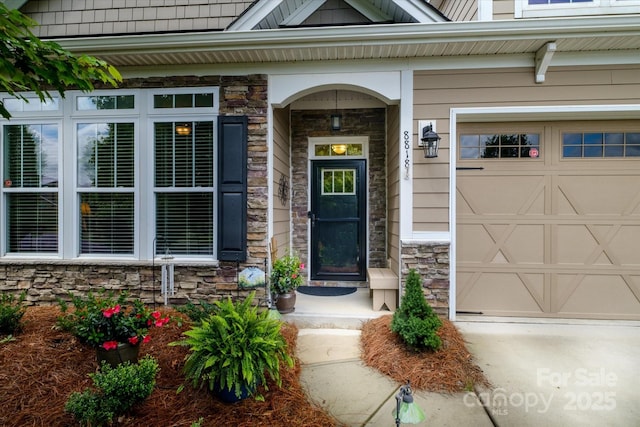 8818 Artesa Mill Ln, Charlotte, NC 28214 - view of exterior entry with stone siding and a garage