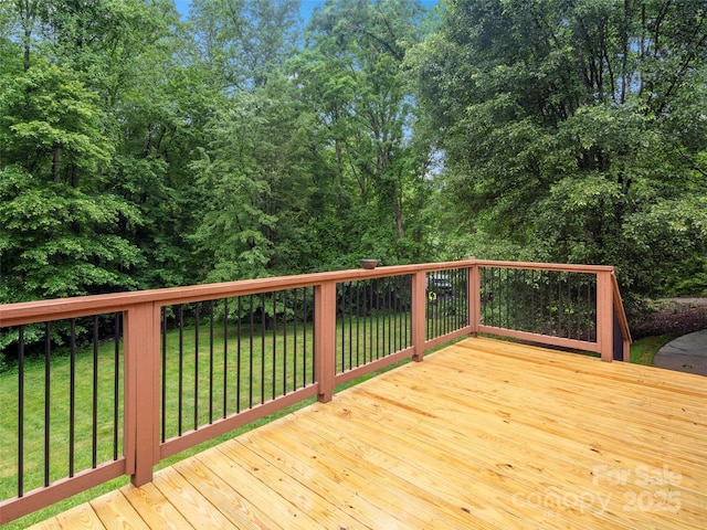 wooden terrace with a yard