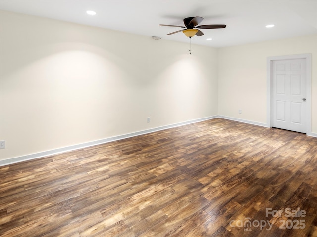 spare room featuring wood finished floors, ceiling fan, recessed lighting, and baseboards