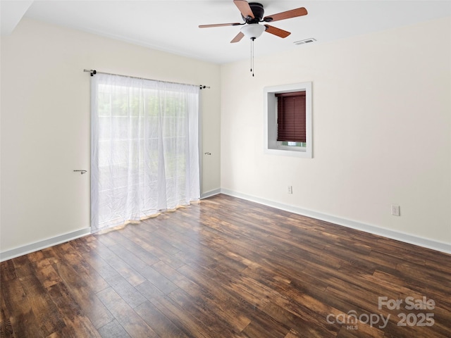 unfurnished room featuring wood finished floors, ceiling fan, and baseboards