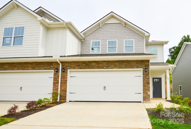 106 Sugg Trl, Weaverville, NC 28787 - view of property with stone siding, a garage, driveway, and board and batten siding