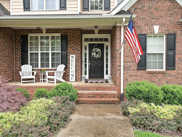 3409 Valdosta Ct, Monroe, NC 28110 - view of exterior entry featuring covered porch and brick siding