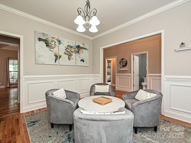3409 Valdosta Ct, Monroe, NC 28110 - sitting room with a chandelier, crown molding, wood finished floors, and wainscoting