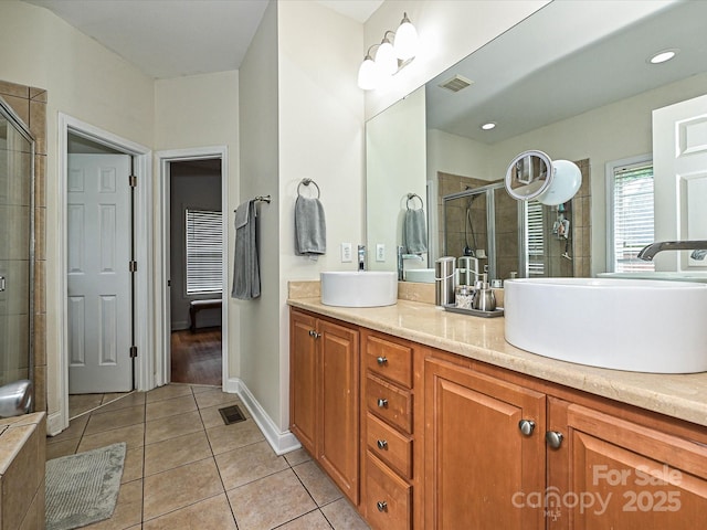 3409 Valdosta Ct, Monroe, NC 28110 - bathroom with tile patterned floors, double vanity, and tiled shower