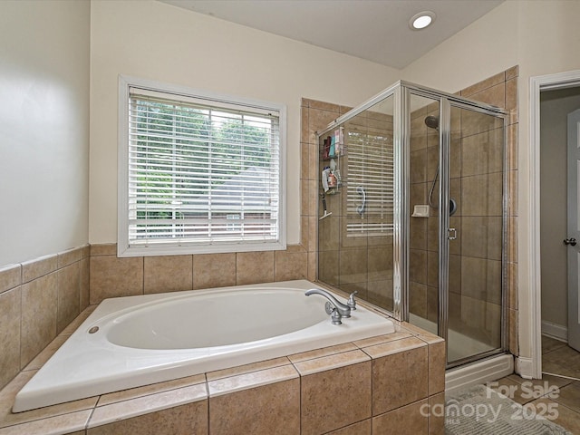 3409 Valdosta Ct, Monroe, NC 28110 - bathroom with a bath, a shower stall, healthy amount of natural light, and tile patterned floors
