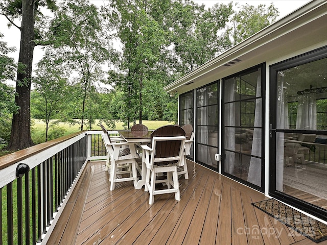 3409 Valdosta Ct, Monroe, NC 28110 - deck with outdoor dining space and view of scattered trees