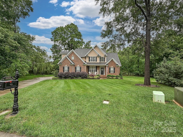 3409 Valdosta Ct, Monroe, NC 28110 - view of front of property with brick siding, driveway, and a front lawn