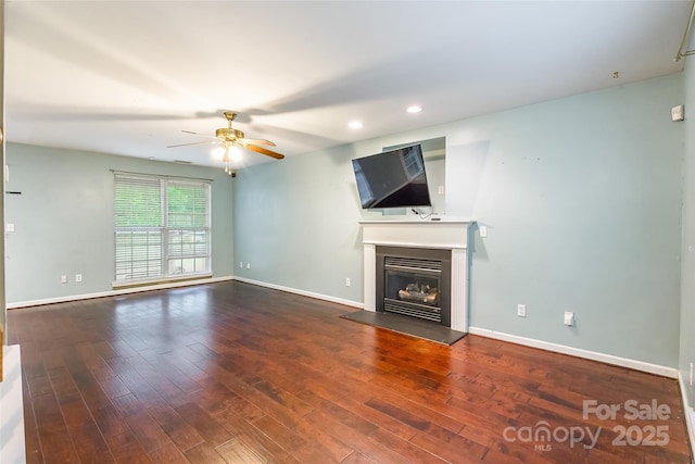 7206 Stoney Place Ct, Charlotte, NC 28262 - unfurnished living room with ceiling fan, wood finished floors, a glass covered fireplace, baseboards, and recessed lighting