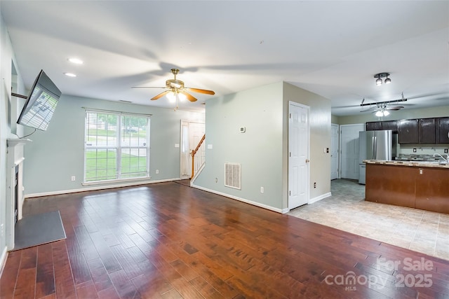 7206 Stoney Place Ct, Charlotte, NC 28262 - unfurnished living room featuring ceiling fan, stairway, baseboards, and recessed lighting