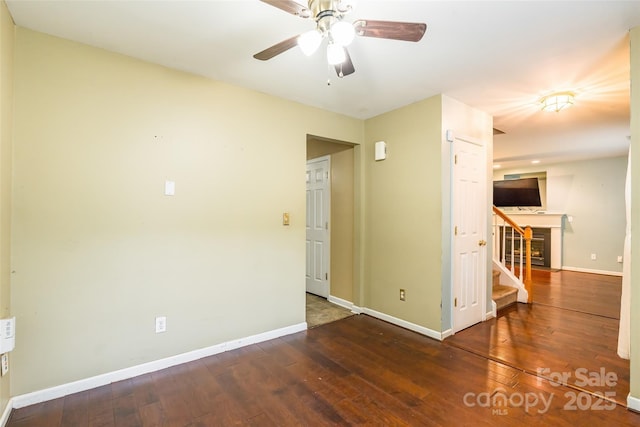 7206 Stoney Place Ct, Charlotte, NC 28262 - unfurnished room featuring baseboards, hardwood / wood-style floors, ceiling fan, and stairs