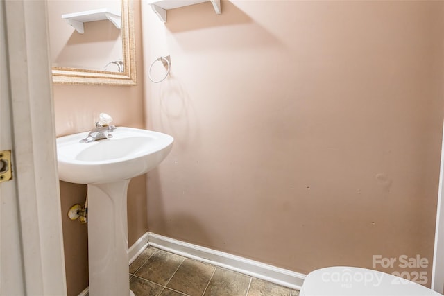 7206 Stoney Place Ct, Charlotte, NC 28262 - bathroom featuring baseboards and toilet