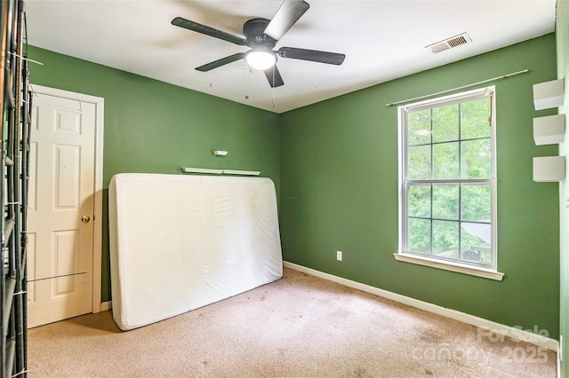 7206 Stoney Place Ct, Charlotte, NC 28262 - unfurnished bedroom with multiple windows, carpet, baseboards, and a ceiling fan
