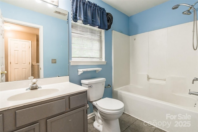 7206 Stoney Place Ct, Charlotte, NC 28262 - bathroom with tile patterned floors, toilet, washtub / shower combination, and vanity