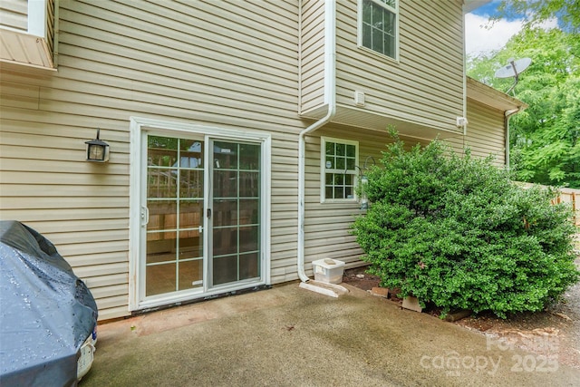 7206 Stoney Place Ct, Charlotte, NC 28262 - view of exterior entry featuring a patio area