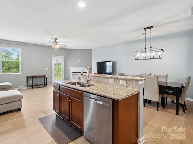 3306 Yarmouth Ln, Gastonia, NC 28056 - kitchen with dishwasher, open floor plan, light wood finished floors, decorative light fixtures, and ceiling fan