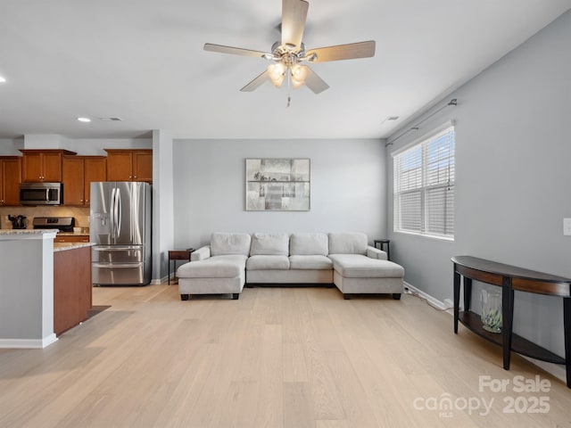 3306 Yarmouth Ln, Gastonia, NC 28056 - living room featuring light wood-style floors, a ceiling fan, and recessed lighting