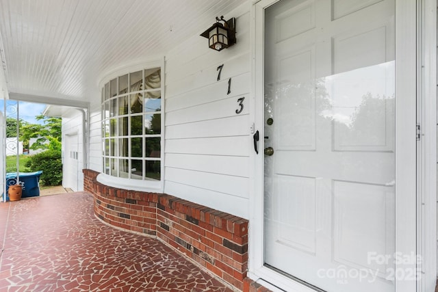 713 Crozet St NW, Valdese, NC 28690 - view of exterior entry with a porch