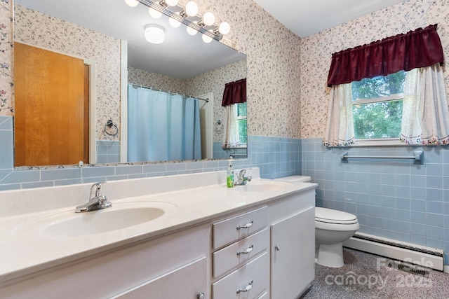 713 Crozet St NW, Valdese, NC 28690 - bathroom featuring wallpapered walls, a baseboard heating unit, double vanity, wainscoting, and toilet