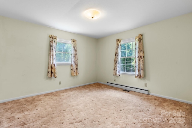 713 Crozet St NW, Valdese, NC 28690 - unfurnished room featuring a baseboard radiator, plenty of natural light, and carpet flooring
