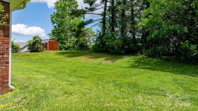 713 Crozet St NW, Valdese, NC 28690 - view of grassy yard with an outbuilding
