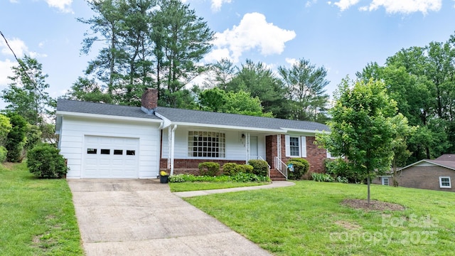 713 Crozet St NW, Valdese, NC 28690 - ranch-style house with an attached garage, a chimney, brick siding, concrete driveway, and a front lawn