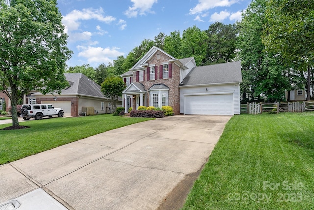 10322 Stoneykirk Ln, Charlotte, NC 28269 - view of front of home with an attached garage, driveway, and brick siding