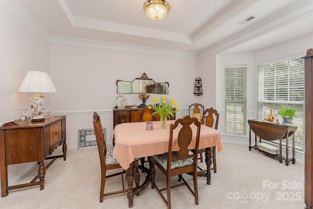 10322 Stoneykirk Ln, Charlotte, NC 28269 - dining room featuring light carpet, a raised ceiling, and crown molding