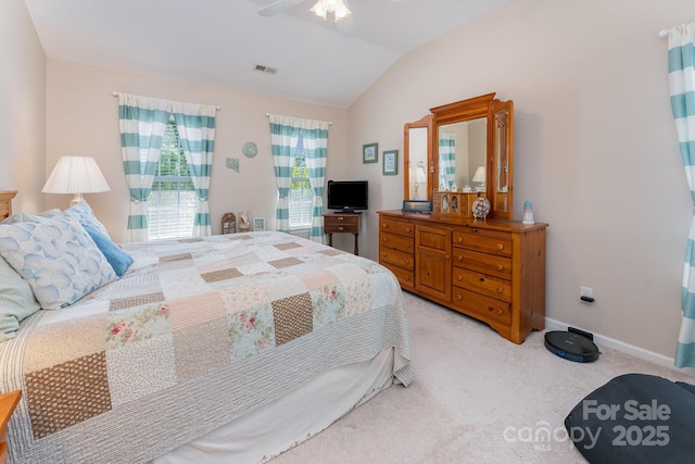 10322 Stoneykirk Ln, Charlotte, NC 28269 - bedroom with vaulted ceiling, light carpet, baseboards, and a ceiling fan