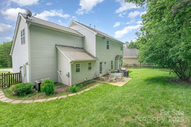 10322 Stoneykirk Ln, Charlotte, NC 28269 - back of house with a patio area, a shingled roof, and central air condition unit