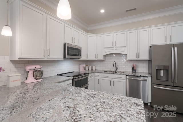 148 Adelaide Way, Rock Hill, SC 29732 - kitchen featuring appliances with stainless steel finishes, a sink, crown molding, white cabinetry, and light stone counters