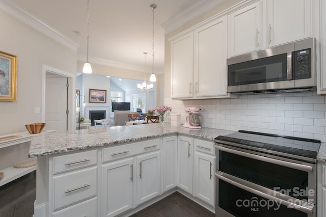 148 Adelaide Way, Rock Hill, SC 29732 - kitchen featuring stainless steel appliances, a peninsula, decorative backsplash, white cabinets, and ornamental molding
