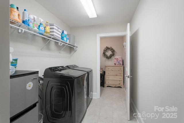 148 Adelaide Way, Rock Hill, SC 29732 - washroom with washer and dryer, light tile patterned flooring, and baseboards